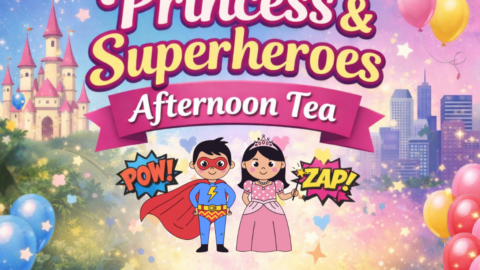 Magical castle backdrop for Princess & Superheroes Afternoon Tea with colourful balloons and city skyline.
