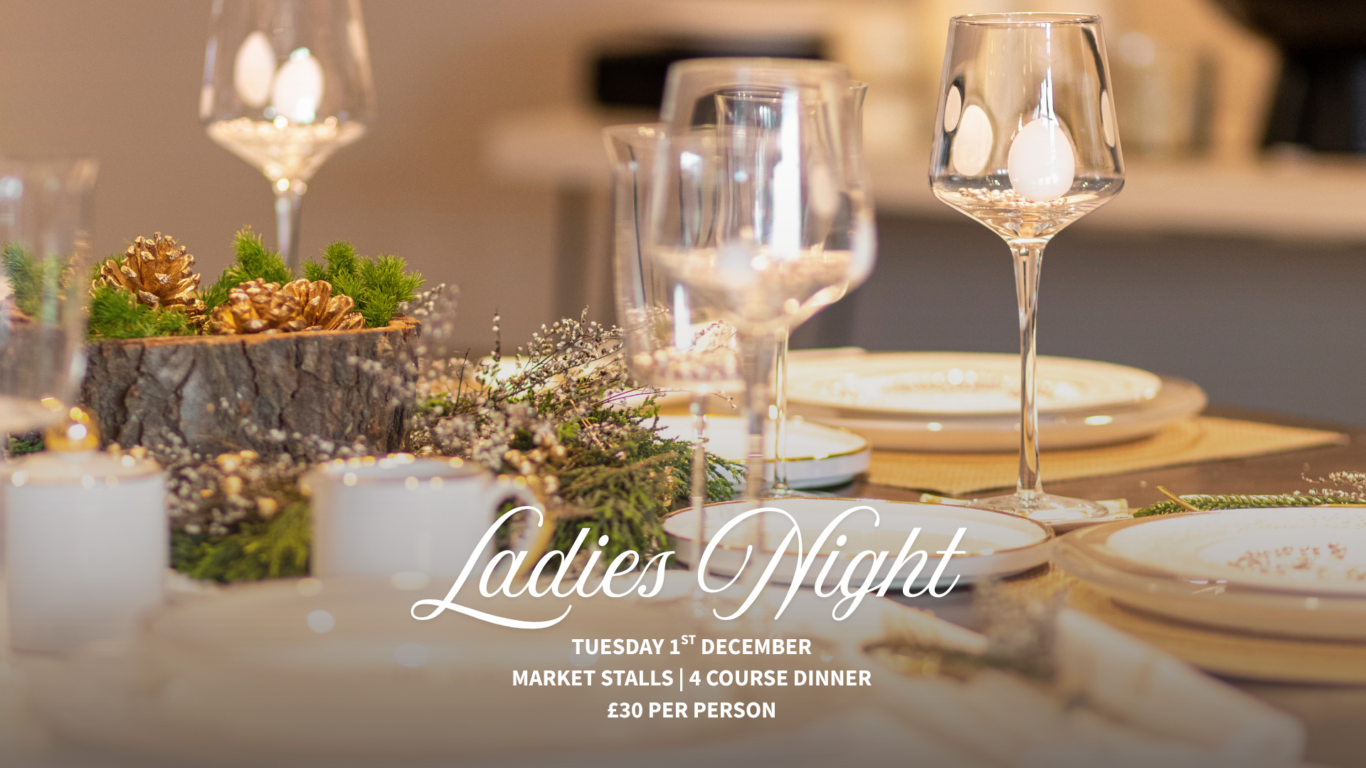Elegant dining table with festive d&eacute;cor, pine centrepiece, fine glassware, set for a welcoming Ladies Night dinner.